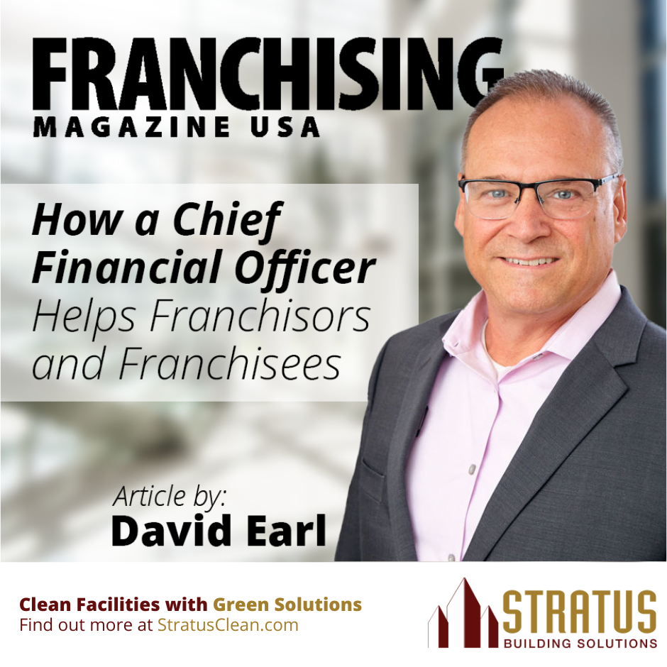 David Earl with the Magazine Title Franchising Magazine USA and a Blurry Office Foyer Backround