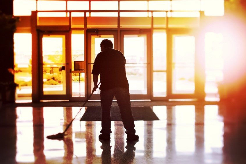 Man mopping commerical floor