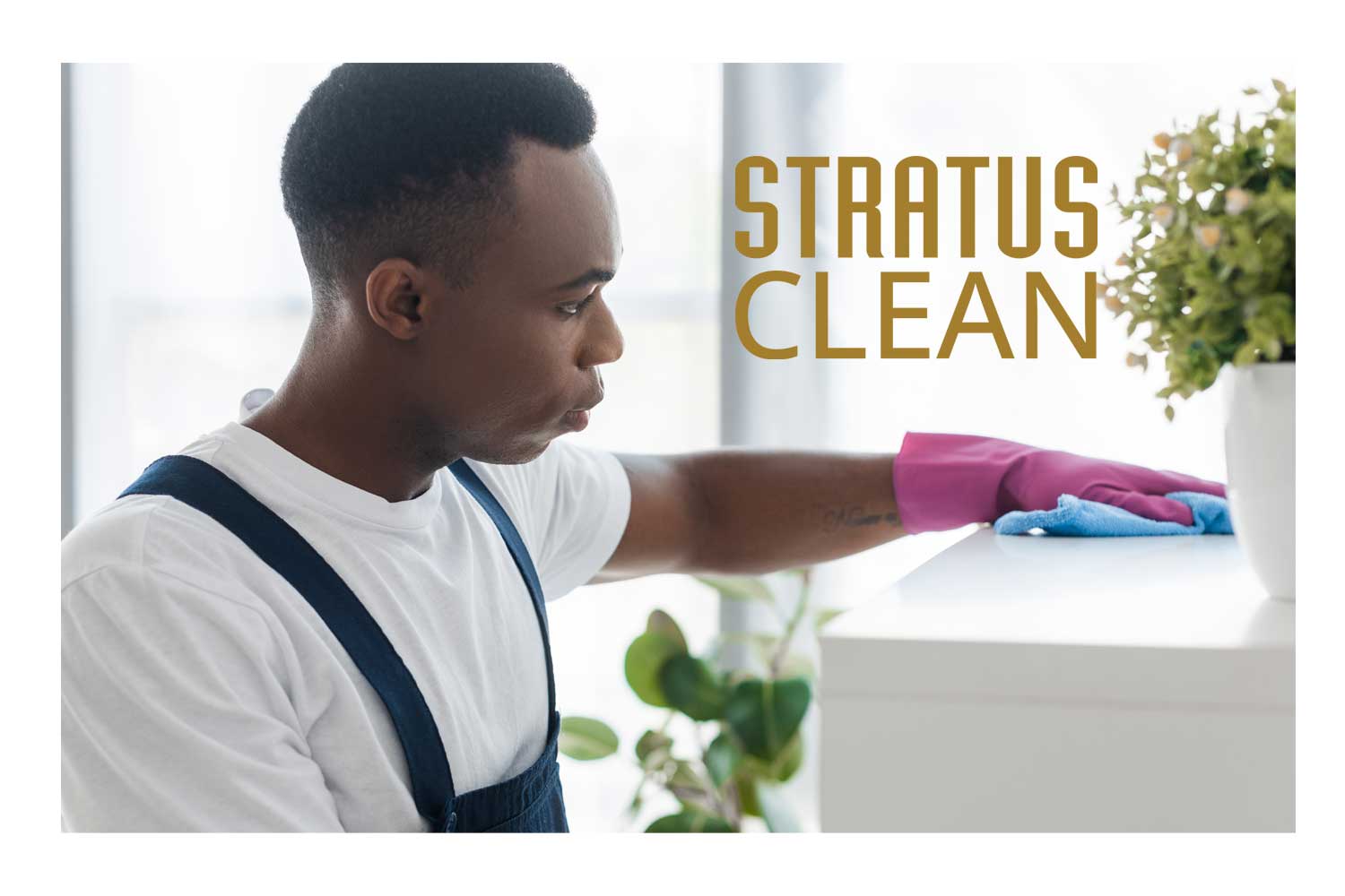 A man wiping down a cabinet with a towel