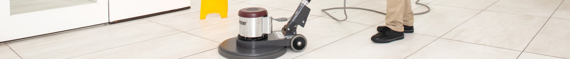 A Stratus Franchisee is Operating a Floor Cleaning Machine in a Commercial Office Building