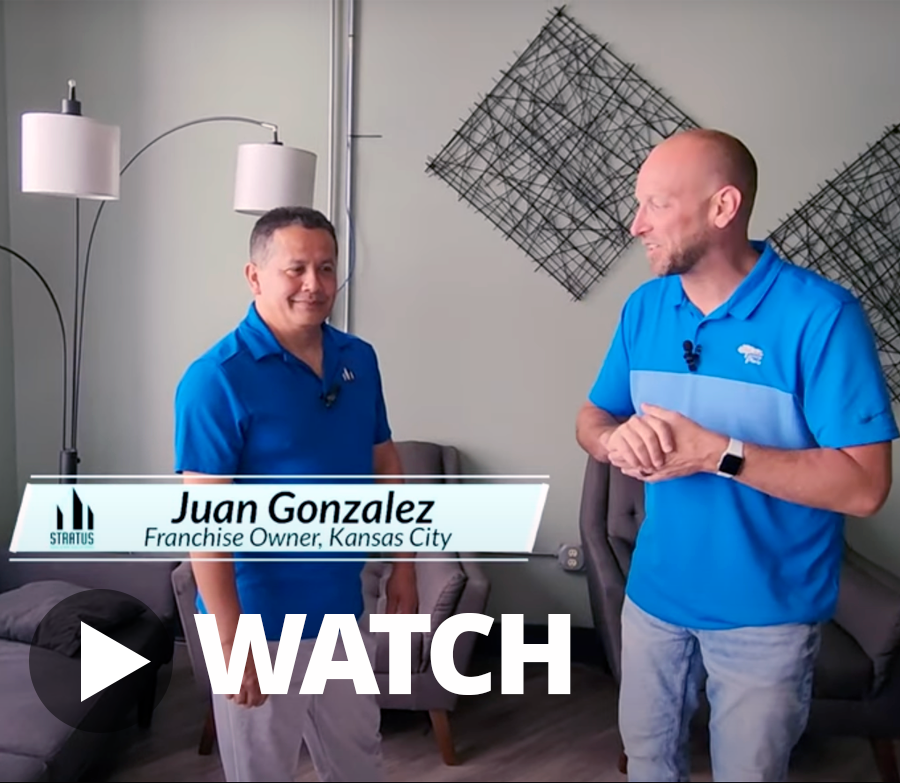 Juan Gonzalez and Ryan Robertson in an Office with a Watch Button