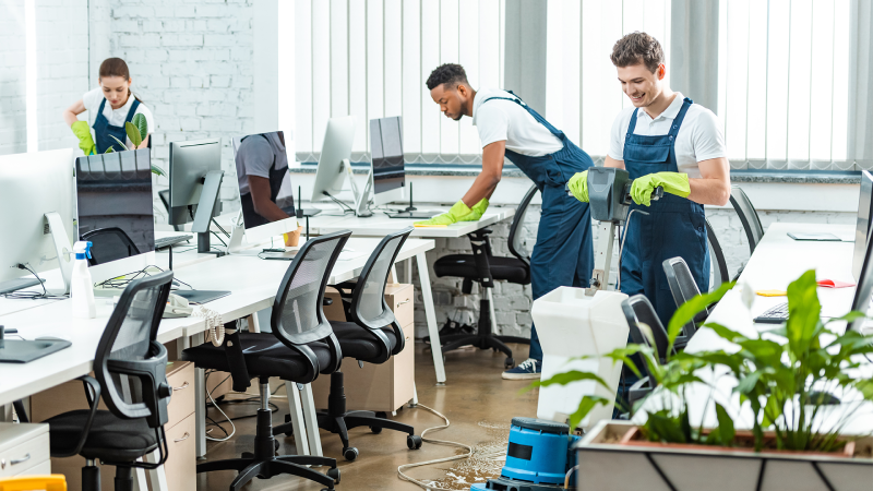 Day porter cleaning staff disinfecting office surfaces in Detroit
