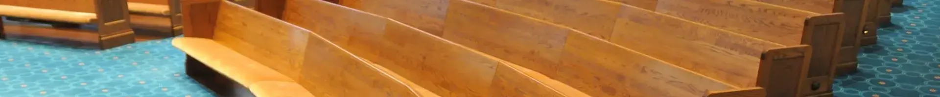 The Inside of a Church Building with Clean Pews and Clean Floors