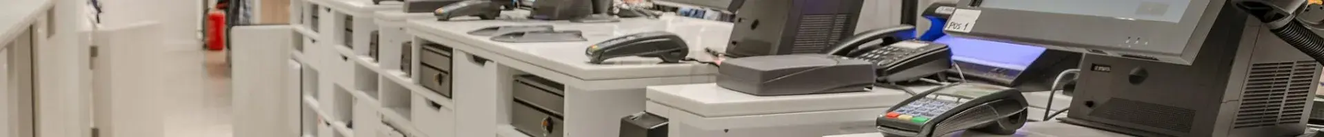 The Inside of a Retail Store Behind the Counter with Five Clean Cash Registers