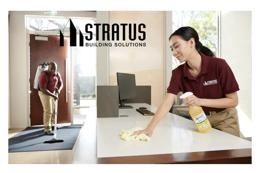 Side-by-Side Images of a Stratus Employee Vacuuming a Floor Mat and a Stratus Employee with a Spray Bottle Wiping a Desk 